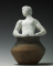 Assemblage : Nu féminin (?) à tête de femme slave, dans un vase