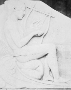 Relief antique d'un homme nu à la lyre
